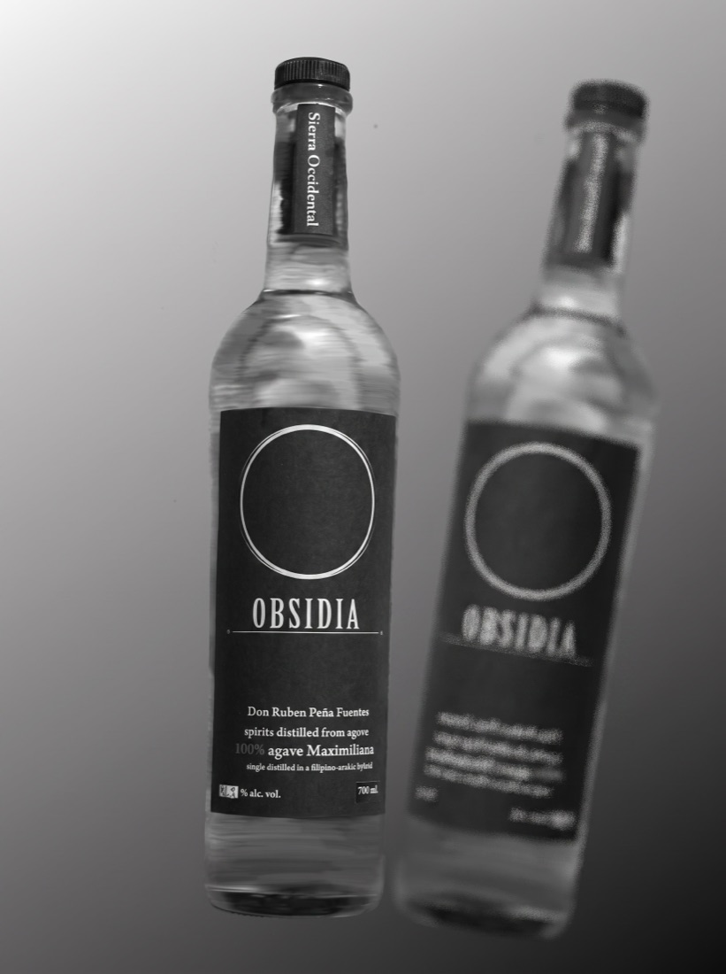 Two black spirit bottles with monochrome custom labels