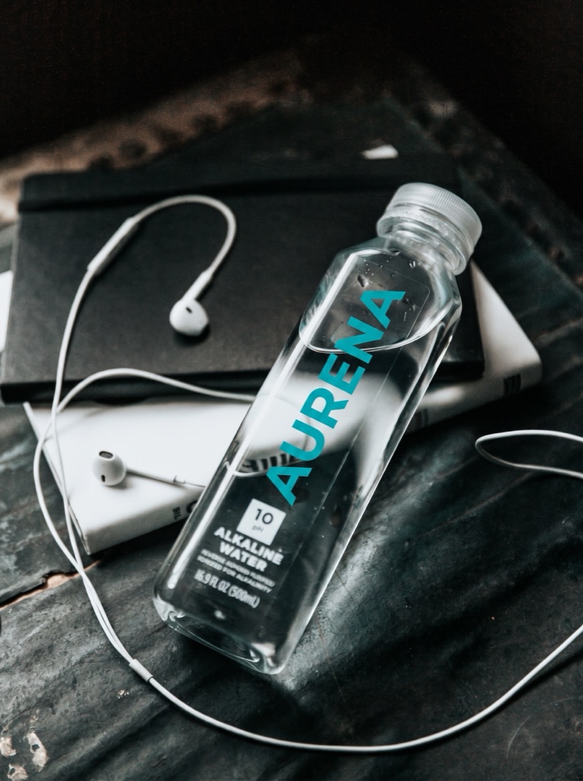 Clear water bottle with a minimalist custom label